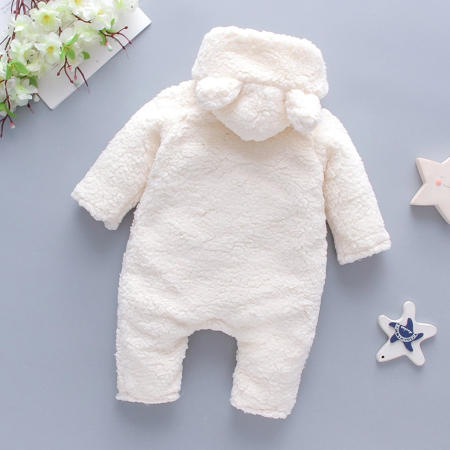 soft baby onesie with bear face and details