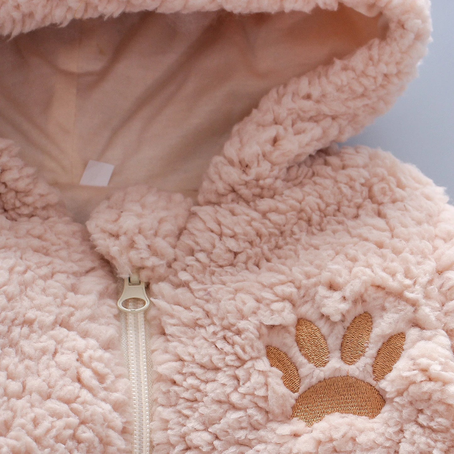 soft baby onesie with bear face and details