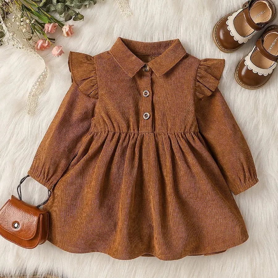toddler in elegant dress for family portraits