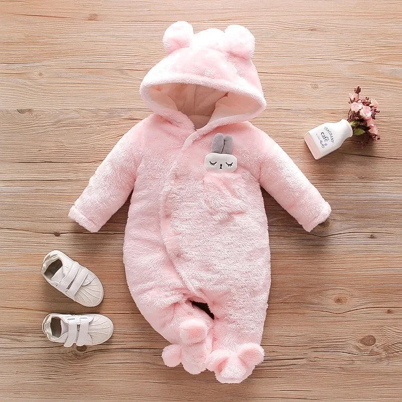 baby in plush fleece hooded jumpsuit