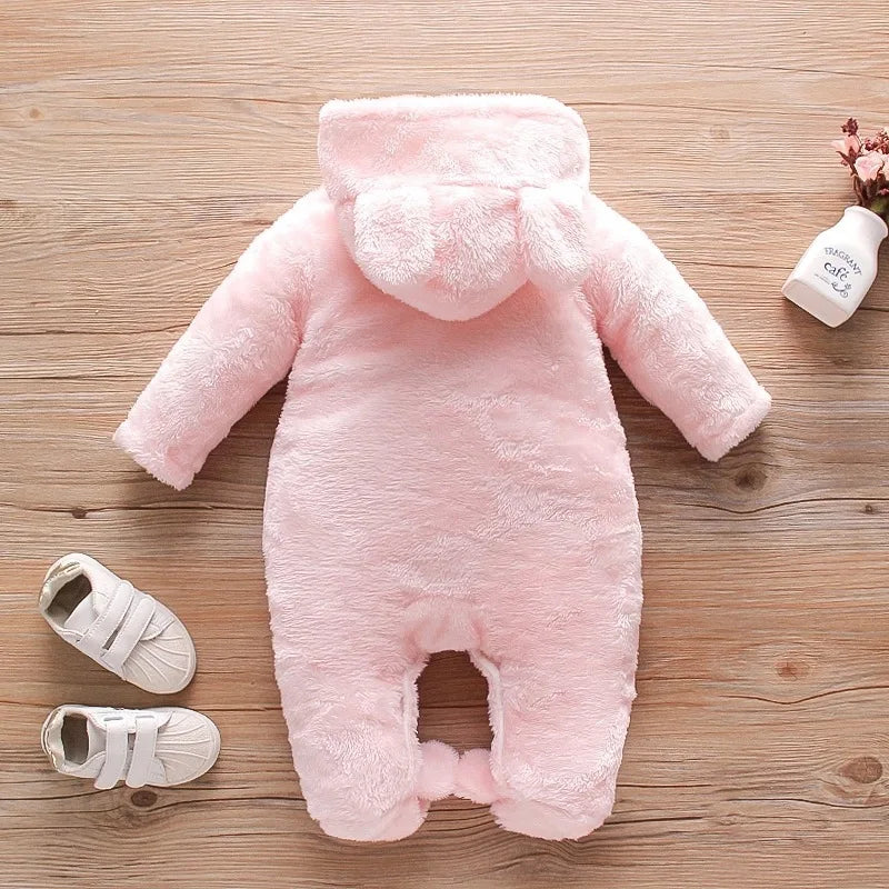 baby in plush fleece hooded jumpsuit