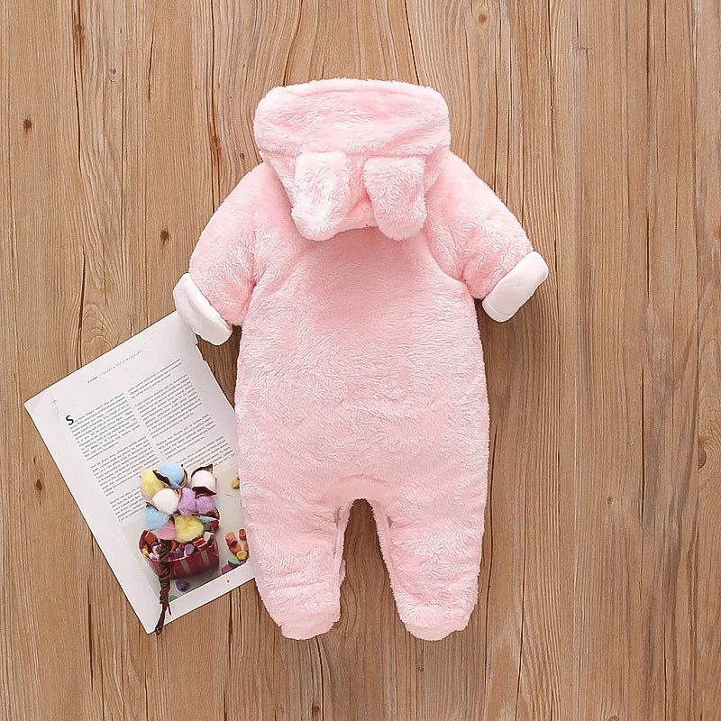baby in plush fleece hooded jumpsuit