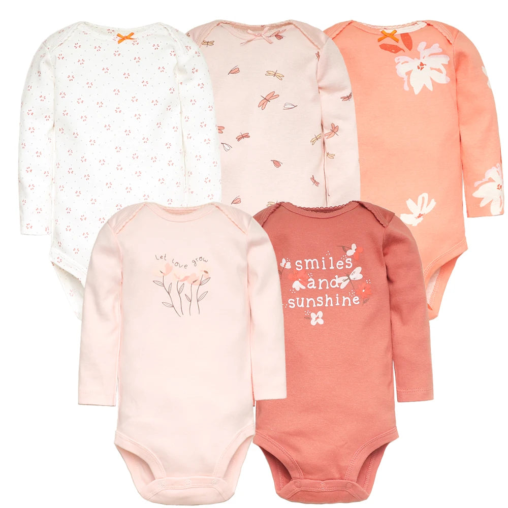 stack of 5 cotton baby bodysuits in neutral tones